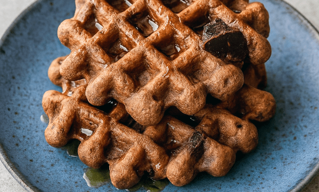 A plate of chocolate brownie waffles made with simple keto ingredients, perfect for Breakfast Ideas Gluten Free Healthy Recipes. Great for a Gluten Free On The Go Breakfast, low-carb eaters, or anyone looking for Sweet Chaffle Recipes Easy and Waffle Maker Recipes Healthy options.