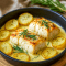 A golden baked dish of Cod With Rosemary Cream Sauce nestled with tender potatoes, topped with fresh parsley, and finished with lemon zest—an elegant weeknight dinner that’s part of One Pot Cod Recipes and perfect for anyone searching for Dinner Ideas With Capers or simple yet Elevated Food Recipes.