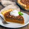A golden Pumpkin And Pecan Pie Recipe with a rich pecan layer baked on top of creamy pumpkin filling, styled as a festive Pumpkin Pie With Topping, perfect for Autumn Pie lovers and holiday Pumpkin Pies.
