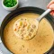 Bowl of Cheesy Italian Sausage Soup with tender potatoes, sausage, and veggies — a creamy Crockpot Potato And Sausage Soup perfect for Comfort Fall Recipes and cozy Fall Time Soups.