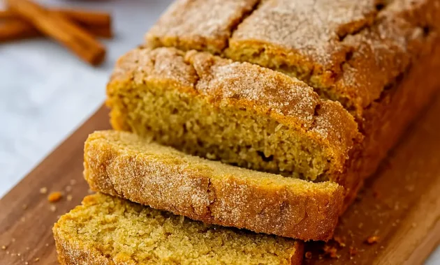 Close-up Of Apple Cinnamon Bread loaf coated in cinnamon sugar, inspired by Apple Cider Donuts — a cozy Apple Cider Donut Bread Recipe that tastes like Farmhouse Apple Fritter Bread With Cider Glaze. Perfect Dessert Bread for fall, great for fans of Bread Recipes Sweet and Bread Recipes Homemade who want to learn How To Make Apple Cider Bread or How To Make Apple Cider Donut Bread at home.
