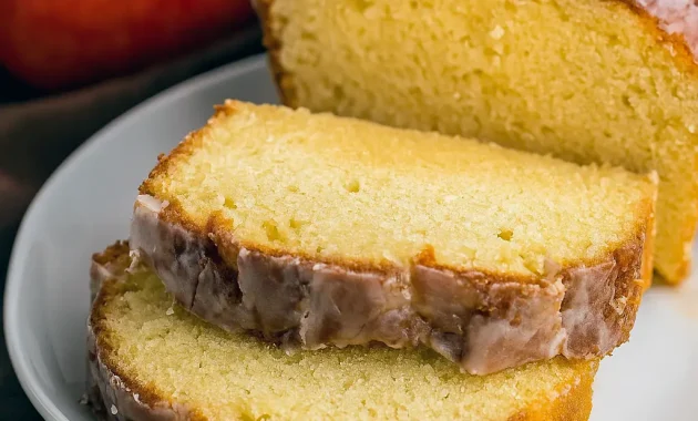 Moist apple cider pound cake drizzled with glaze on a cooling rack, a cozy Apple Cider Recipe that’s perfect for fall gatherings, ideal for Cider Recipe fans who love Apple Dessert Recipes, Baking Sweets, and homemade Dessert Bread. A must-try in the world of Pound Cake Recipes for easy Fall Baking, great to Eat Dessert anytime or enjoy as a Sweet Breakfast with coffee.