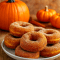 A batch of golden Pumpkin Baked Donut Recipe topped with cinnamon sugar, perfect Pumpkin Cake Doughnuts Baked for Easy Morning Baked Goods. Delicious Baked Pumpkin Doughnut Recipes made with pumpkin puree, ideal as Baked Pumpkin Donuts With Buttermilk, a classic Pumpkin Recipes Donut, tasty Pumpkin Donut for fall, fun Baking Halloween treat, and a must-try Pumpkin Spice Doughnut Recipe.
