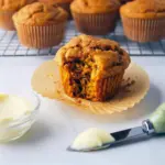 Stack of golden muffins labeled Kodiak Pumpkin Muffins Recipe, each bite showing the moist crumb of a Low Calorie High Protein Pumpkin Muffins batch — a visual of Protein Pumpkin Muffins Kodiak made with wholesome ingredients, hinting at other High Protein Kodiak Recipes and the pumpkin-forward flavor of Kodiak Pumpkin and Pumpkin Kodiak; great photo to inspire High Protein Pancake Muffins, Healthy Recipes With Canned Pumpkin, and grab-and-go Breakfast Muffins Protein.