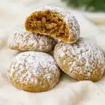 A plate of festive Gingerbread Snowball Cookies rolled in powdered sugar, the perfect Christmas Cookies Snowballs for holiday gatherings. These soft, spiced Ginger Snowball Cookies also work as Gingerbread Balls or even creative Sourdough Snowball Cookies, making them a versatile addition to your dessert table. Pair with Gingerbread Snowballs, fun Gingerbread Thumbprint Cookies, or other bite-sized Ball Cookies for a winter wonderland of Snow Balls Cookies.