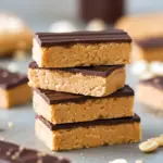 Stack of chocolate-drizzled bars on parchment, a visual guide to How To Make No Bake Protein Bars and a great example of Protein Bars Homemade Healthy No Bake; close-up shows one Protein Bar cut to reveal texture — ideal for bookmarking under Protein Bar Recipes.