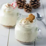 Eggnog Mousse Recipe: creamy eggnog mousse in a mason jar topped with gingerbread streusel and a light dusting of nutmeg.