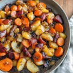 Close-up of glossy roasted apple and carrot slices on a platter, golden and caramelized — perfect Thanksgiving Dish.