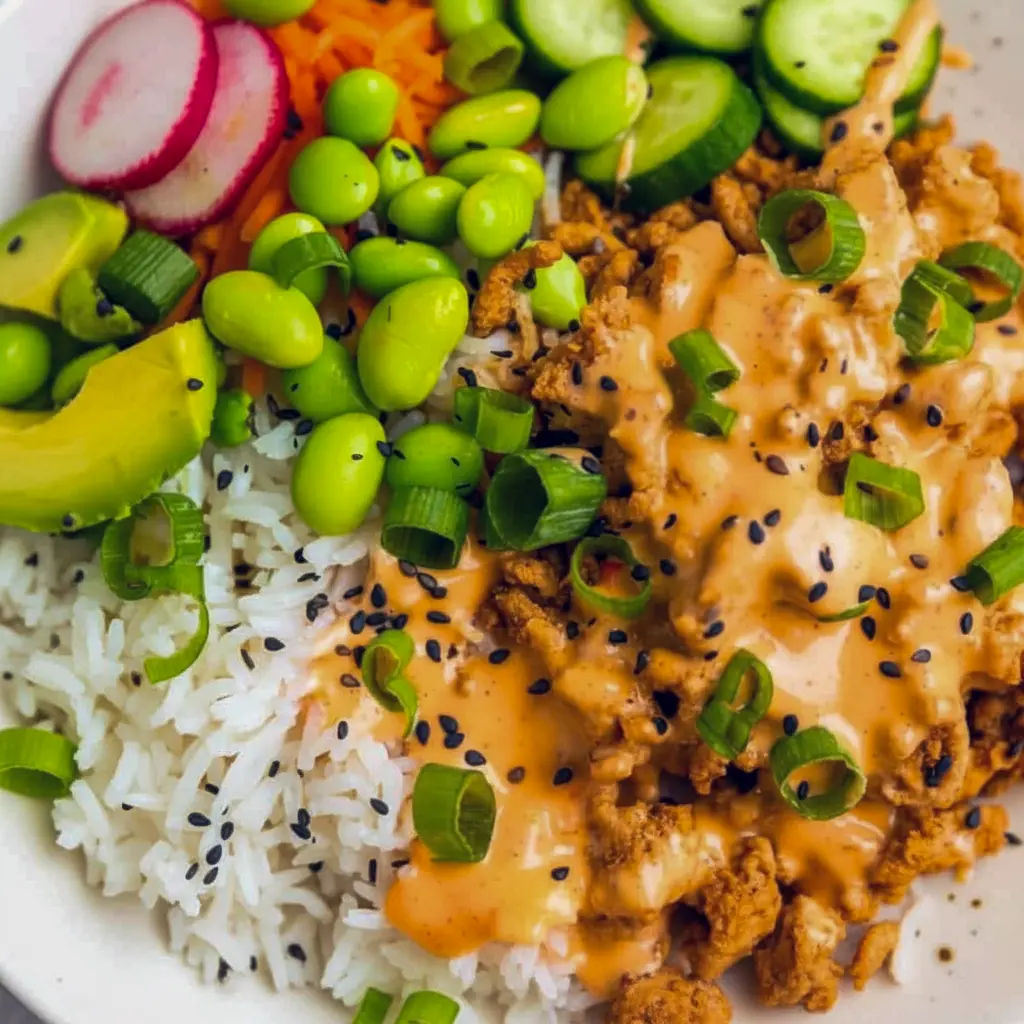 A colorful Bang Bang Ground Turkey Bowl topped with creamy sauce, sesame seeds, and green onions — an easy Low Effort Dinner inspired by Define Dish Recipes, perfect for Non Red Meat Meals and weeknight Alpha Gal Meals.