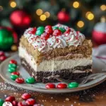 No-bake layered Oreo pudding dessert topped with colorful sprinkles and mini candies, Last Minute Christmas Desserts.