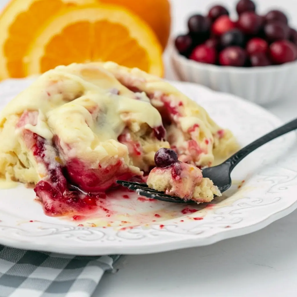 Glazed Orange Sweet Rolls on a platter — a cozy Holiday Baking scene ready for Thanksgiving Brunch; a bite shows jam, perfect Breakfast Sweets inspired by top Cranberry Recipes for Christmas Breakfast, a classic Sweet Roll for Breakfast Brunch Recipes or a Boulangerie display.