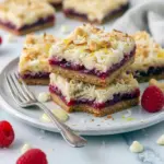 Lemon Magic Cookie Bars — close-up of jam-filled, coconut-topped squares; chewy, glossy Raspberry Jam Bars, Raspberry Magic Bars.