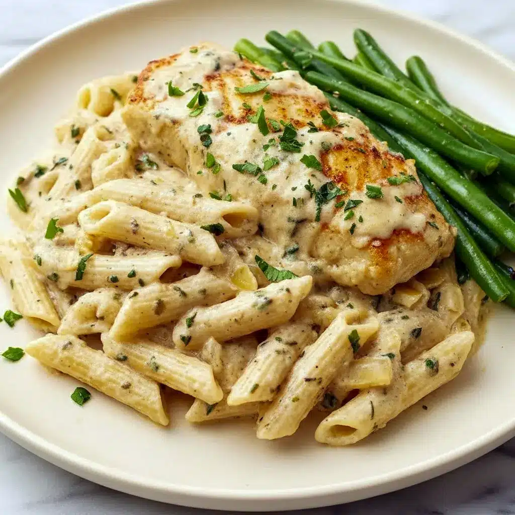 Close-up of golden, pan-seared salmon in a creamy herb sauce over pasta — a delicious Fish And Seafood plate that practically screams I Love Food, Boursin Recipes.