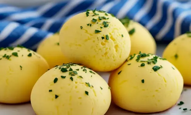 Savory Ricotta Recipes brought to life — close-up of golden ricotta egg bites in a muffin tin, topped with chopped chives and a lemon wedge, a perfect example of Egg Bites Easy for busy breakfasts.