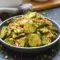 Bowl of Peanut Sauce Cucumber Salad: sliced cucumbers coated in spicy peanut dressing, topped with toasted peanuts and parsley — a bright Peanut Butter Lunch or side dish.