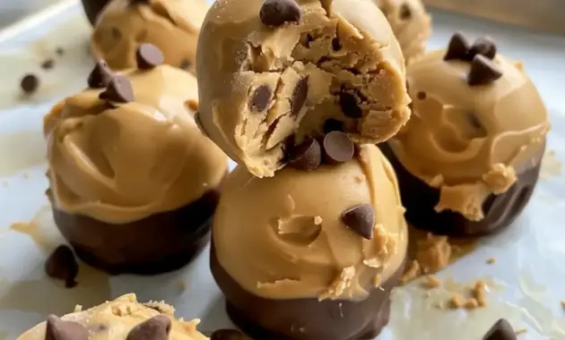 Greek Yogurt And Peanut Butter frozen bites on a small plate, dotted with mini chocolate chips — perfect Greek Yogurt Bites for a healthy snack.