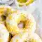 Stack of lemon-vanilla baked donuts with a glossy glaze — Easy Protein Donut Recipe styled as Glazed Protein Donuts and labeled Gluten Free Protein Donuts.