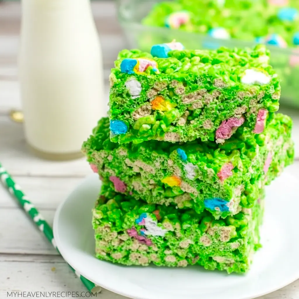Close-up of a green Lucky Charms Rice Krispie square with marshmallow bits and a glossy finish — St Pats Day Snacks and St Patrick Day Treats styled on a festive platter.