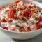 Strawberry Crackle Salad — creamy whipped filling layered with bright sliced strawberries and crunchy pretzel-pecan crackle in a bowl; a fresh, no-bake Light Cold Dessert ready for summer.