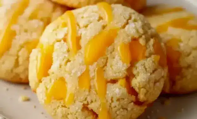 Close-up of chewy mango cookies on a cooling rack, dusted with sugar — Fruit Flavored Cookies ready to eat.