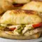 Chicken Pesto Sandwich on toasted ciabatta with juicy chicken, melted mozzarella, tomato slices, and pesto for a quick Healthy Chicken Sandwich Recipes style dinner.