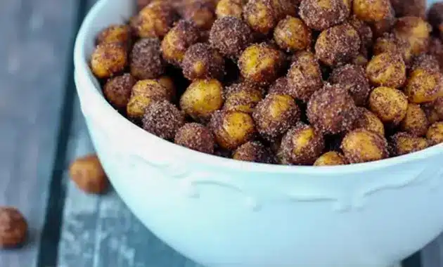 Cinnamon Roasted Chickpeas — golden, crispy chickpeas coated in cinnamon sugar and served in a rustic bowl; a close-up of Cinnamon Sugar Chickpeas ready to snack.