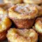 Close-up of fluffy Cinnamon-Sugar French Toast Muffins brushed with butter and sprinkled with cinnamon sugar — a handy Freezable Breakfast Recipes option for busy households.