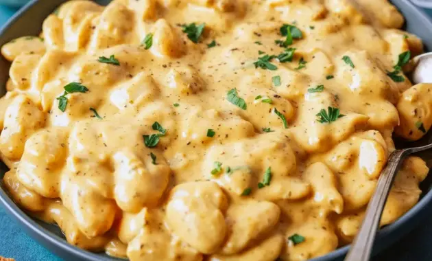 A cozy bowl of Garlic Parmesan Butter Beans topped with parmesan and herbs, styled as a comforting Homemade Beans Recipe for dinner.