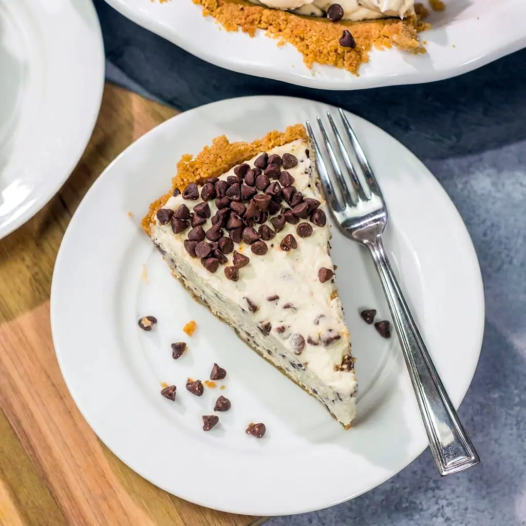 A close-up of Chocolate Chip Cannoli Pie showing its sweet crust and rich Cannoli Inspired Dessert filling.