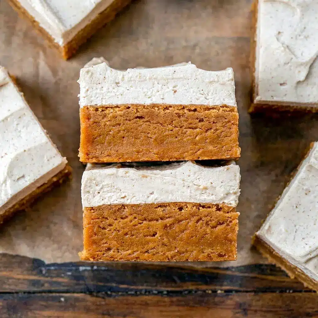 Close-up of Frosted Gingerbread Brownies dusted with spice, featured as one of the Best Desserts For Christmas.