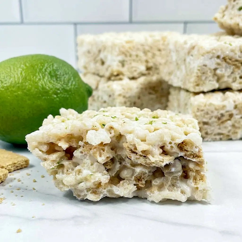 A colorful tray of Key Lime Pie Rice Krispie Treats with citrus flavor, ideal for Recipes For Limes and easy summer desserts.