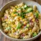 Mexican Street Corn Pasta Salad is a colorful Potluck Items To Bring idea with creamy dressing, corn, and cotija cheese.