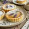 Mini Salted Honey Lavender Pies styled on a tea tray with a soft Lavender Recipes aesthetic.