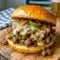 Cozy plate of Philly Cheesesteak Sloppy Joes served warm for Dinner For Football Night with toasted buns and melty cheese.