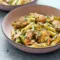 Salmon Pesto Pasta served in a creamy bowl for an easy Pescetarian Dinner.