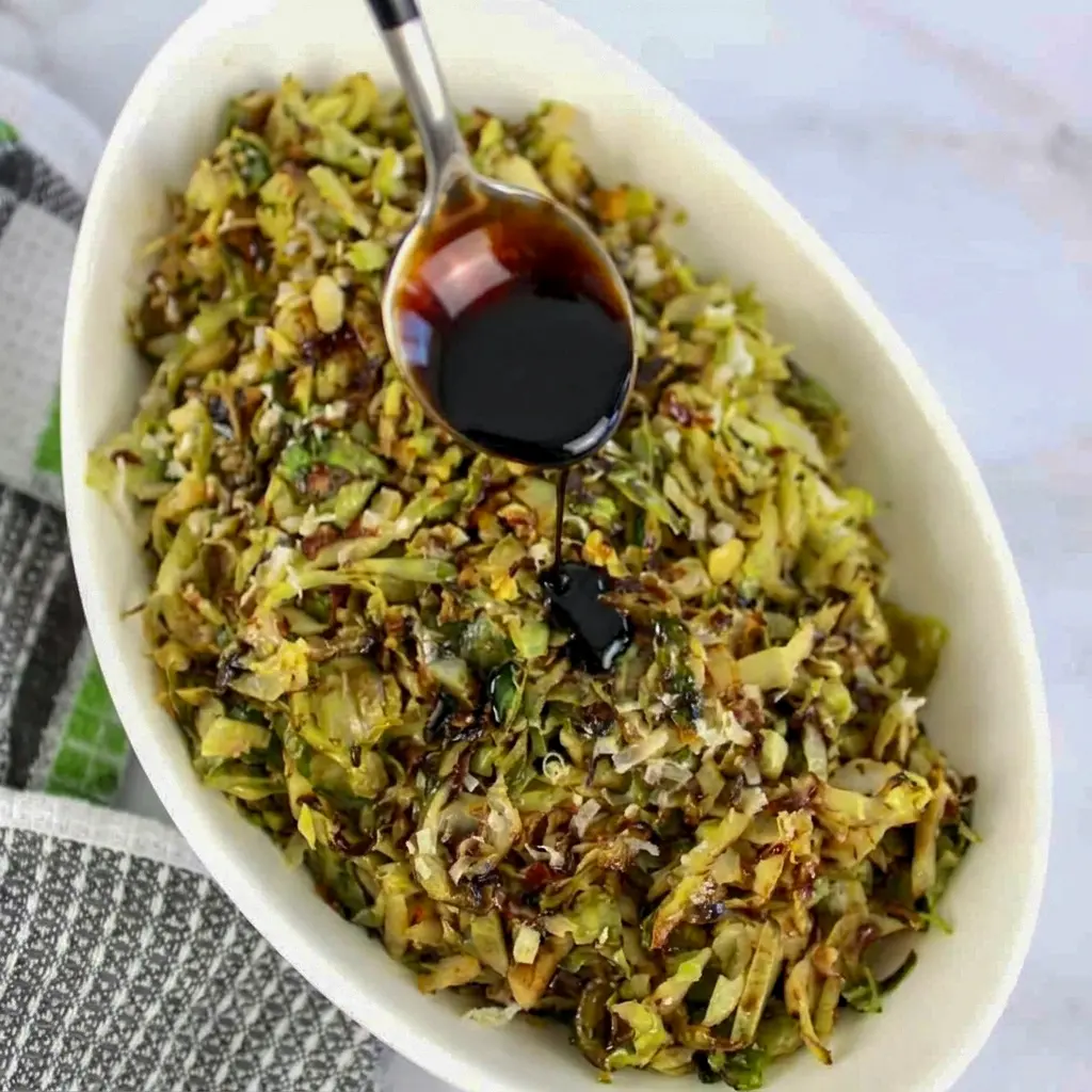 Warm Shredded Brussels Sprouts tossed in butter and bacon grease, a tasty answer for How To Make Shredded Brussel Sprouts at home.