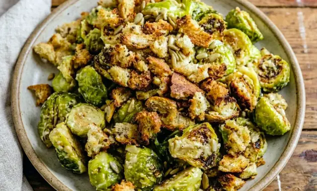 Roasted Brussels Sprouts Caesar Salad served as a crisp Caesar Brussels Sprouts side with golden croutons and creamy dressing.